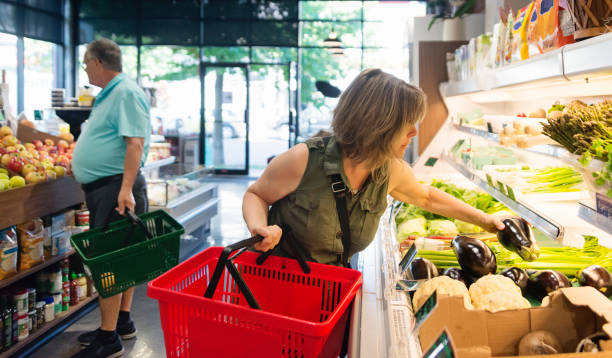 istock Customers shopping in small zero waste oriented fruit and grocery store. 1160093981