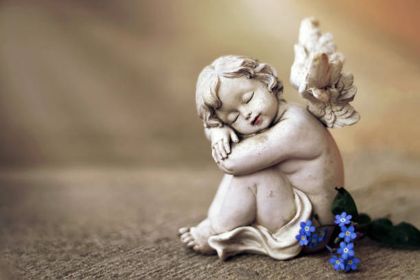 istock Guardian angel and spring flowers 1160094265