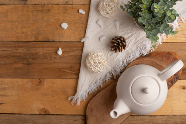 istock Ceramic white teapot with accessories on a wooden table, horizontal frame, tea time, tea drinking, retual tea making 1160099878