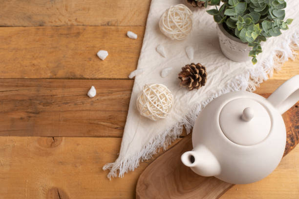 istock Ceramic white teapot with accessories on a wooden table, horizontal frame, tea time, tea drinking, retual tea making 1160100685
