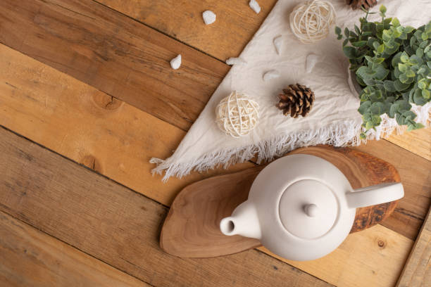 istock Ceramic white teapot with accessories on a wooden table, horizontal frame, tea time, tea drinking, retual tea making 1160101490