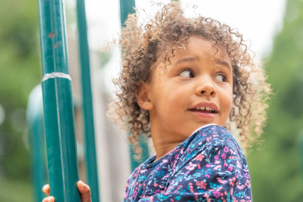 istock Smiling little girl looking away 1160104843