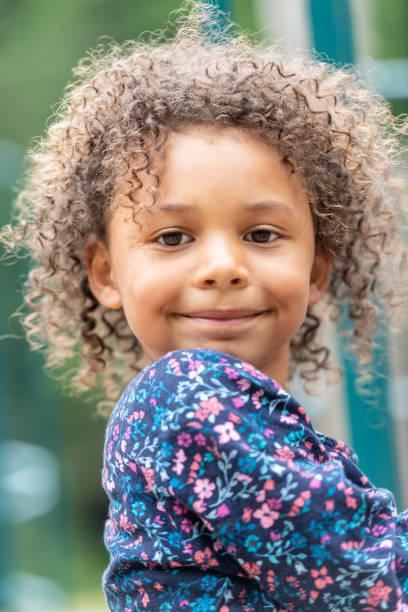 istock Smiling little girl looking at the camera 1160104856