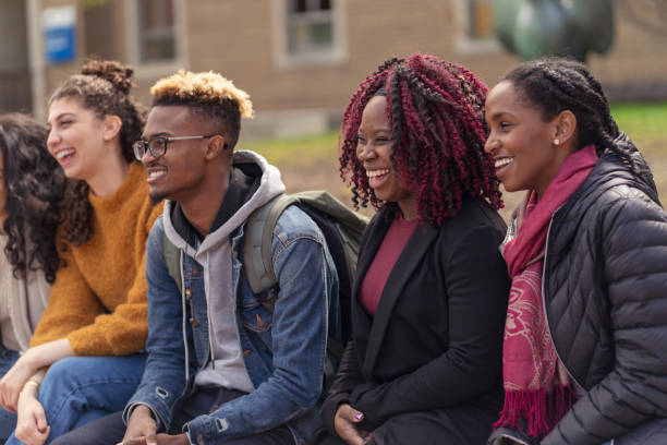 istock Multi-Ethnic Group of University Students Relaxing Outside 1160108872