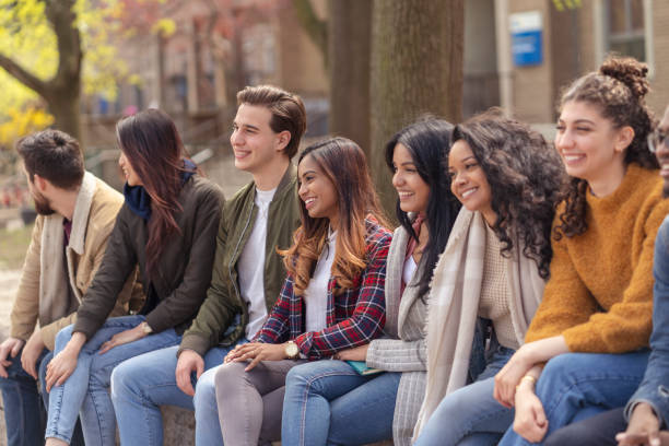 istock Multi-Ethnic Group of University Students Relaxing Outside 1160108874