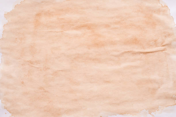 istock brown splotch stained paper background spilled tea 1160109287