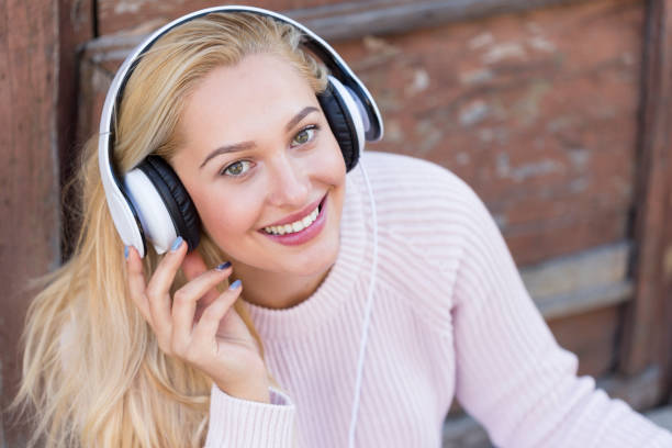 istock Young Woman with Headphones 1160109458