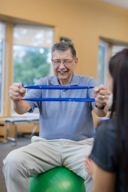 istock A senior man works with his  occupational therapist 1160110925