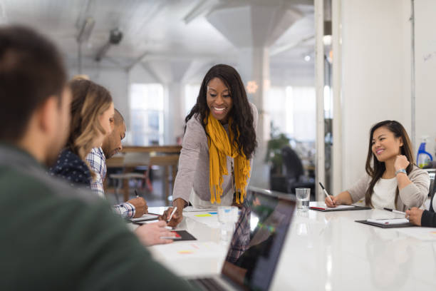 istock Black female CEO leads a team meeting 1160111879