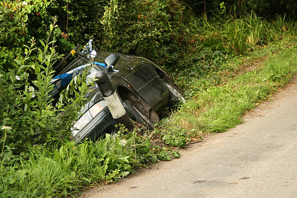 Car crash scene Crashed car in a ditch ditch stock pictures, royalty-free photos & images