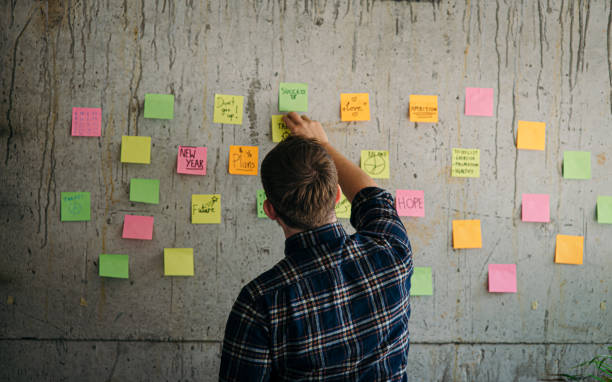 Man Putting Sticker 10+ Putting Sticker On Wall Stock Photos, Pictures & Royalty-Free ...