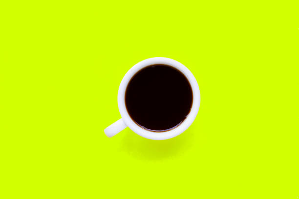 istock Hot black coffee on  green yellow background. 1160125027