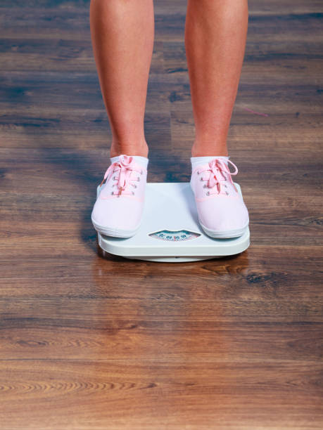istock Woman feet on scales. 1160127036