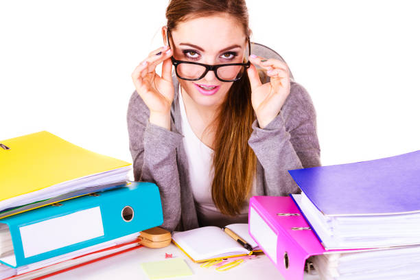 istock Woman sitting at desk in office working 1160127764