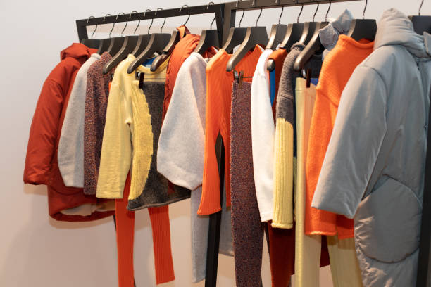 istock Fashion Design Clothes on Display rack in retail 1160128599