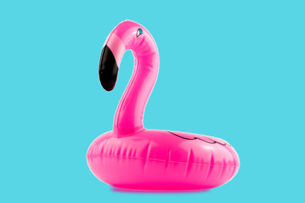 istock Giant inflatable Flamingo on a blue background, pool float party, trendy summer concept 1160128629