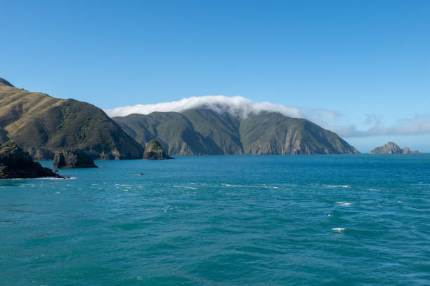 istock Sailing across the ocean in a ferry past the lighthouse and coast 1160132613