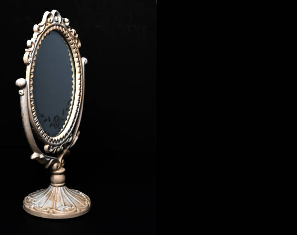 istock Vintage Oval Desk Mirror with white frame on black background. Silver Rose Ornament 1160139374