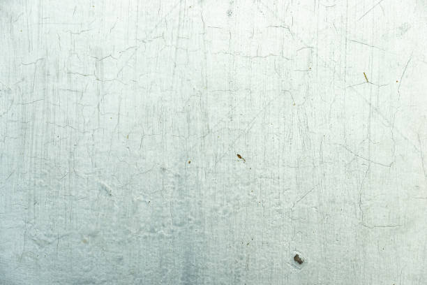 istock Texture of peeling and cracking white paint on concrete wall 1160147203