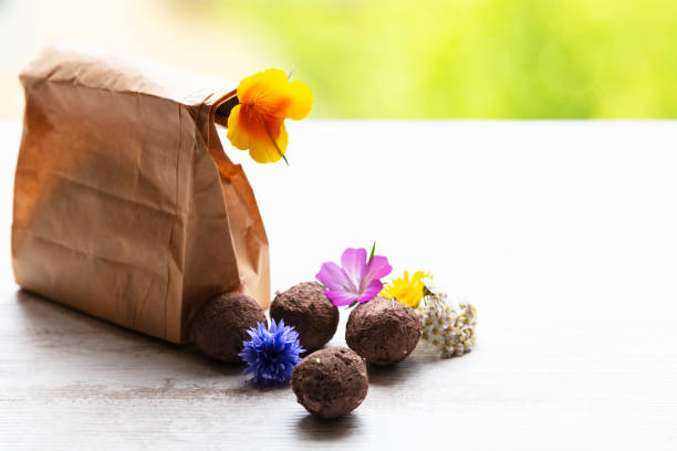 istock seed balls or seed bombs with various blossoms on a white, wooden background 1160147318