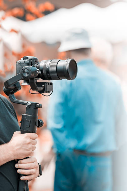 istock Video shooting with a camera with a tripod with a black stabilizer 1160147418