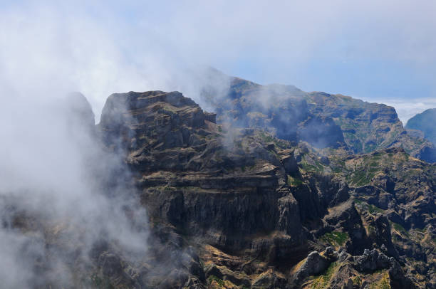 trade winds (passat) bring clouds and rainy weather. mountain range pico ruivo (northeastern edge of the central highlands). island madeira - trade winds imagens e fotografias de stock