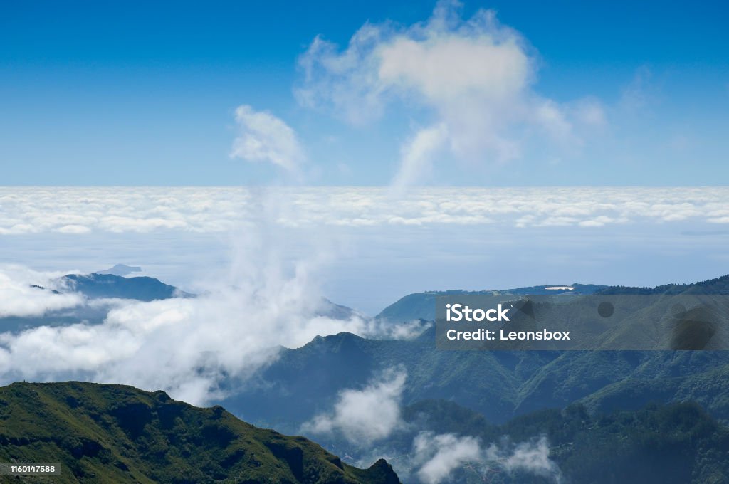 Trade winds (Passat) bring clouds and rainy weather. Mountain range Pico Ruivo in the northeastern edge of the central highlands. Madeira Trade winds bring clouds and rainy weather. Mountain range Pico Ruivo in the northeastern edge of the central highlands. Madeira Adventure Stock Photo