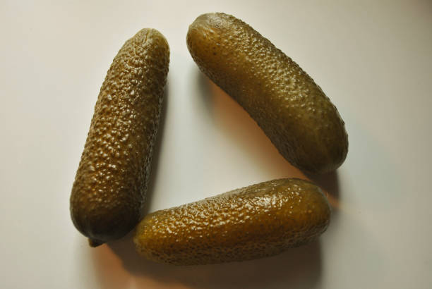 Three Pickles on white background.