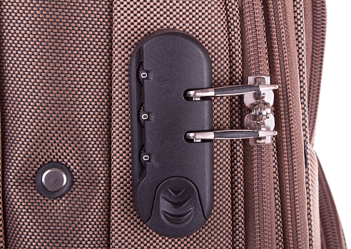 A closeup shot of the combination lock built in suitcase
