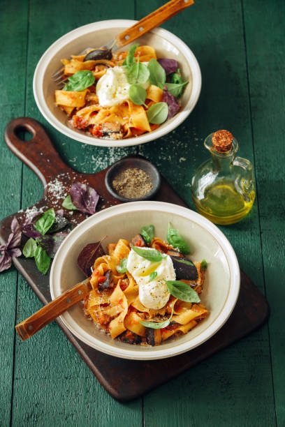 istock Pappardelle with eggplant, creamy tomato sauce and mozzarella 1160157472