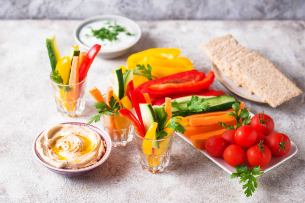 istock Healthy snacks. Vegetables and hummus 1160161036