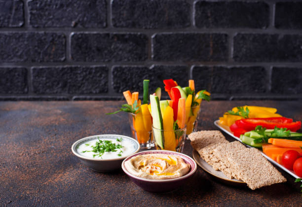 istock Snacks bar. Vegetables sticks and hummus 1160161058
