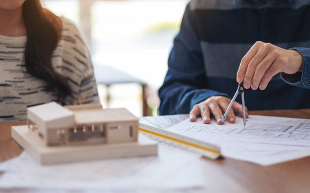 istock An architect using compass to draw and measure shop drawing 1160165795