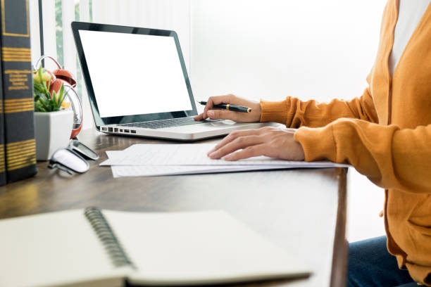 istock Midsection Of Woman Using Laptop On Table 1160169203