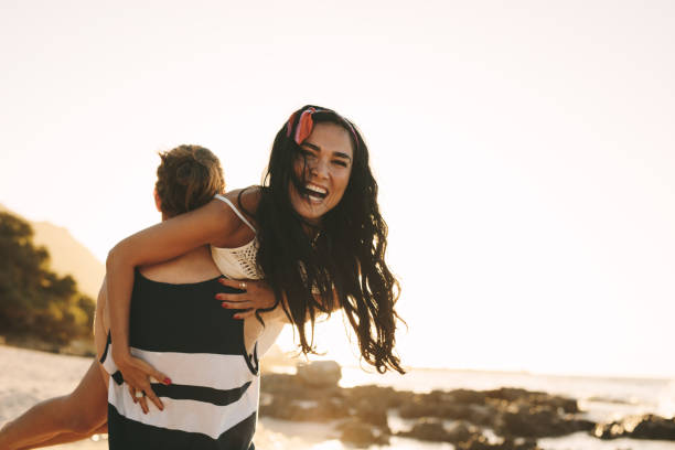 istock Tourist couple having fun at the beach 1160170557