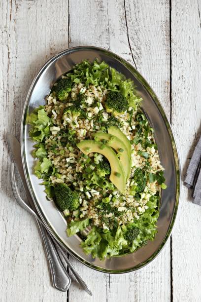 istock Bulgur salad with avocado, green vegetables and greenery 1160175316