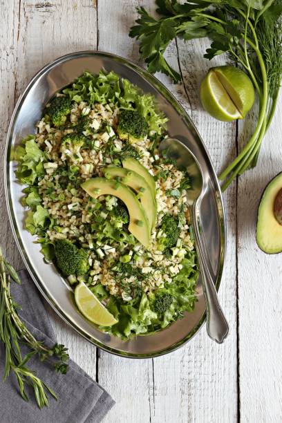 istock Bulgur salad with avocado, green vegetables and greenery 1160175317