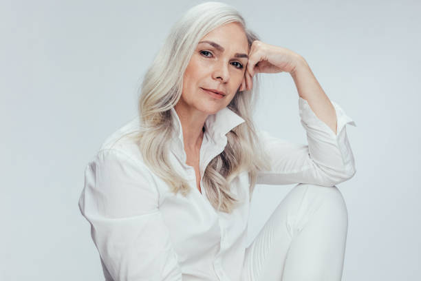 istock Senior woman over white background 1160175602