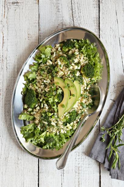 istock Bulgur salad with avocado, green vegetables and greenery 1160175617