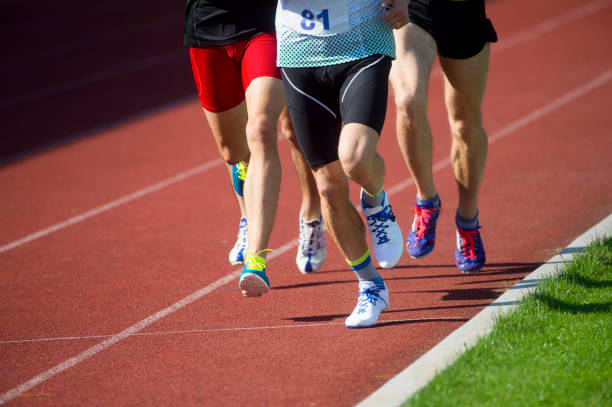 istock Low Section Of Men Running Marathon 1160175800