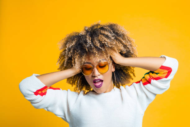 istock Trendy african woman dancing in studio 1160178085