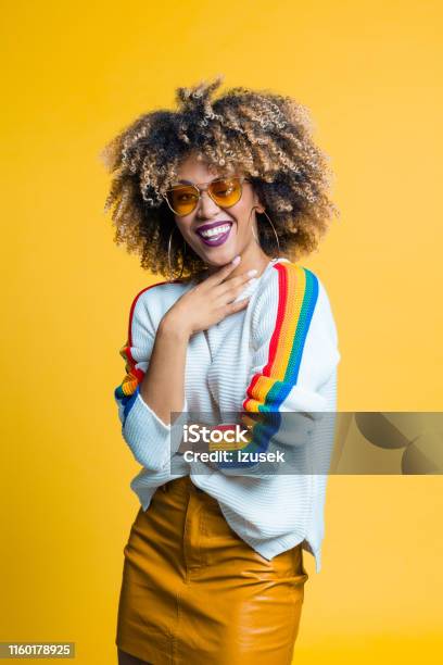 Portrait Of Pretty Afro Young Woman Stock Photo - Download Image Now - Women, One Woman Only, Yellow Background