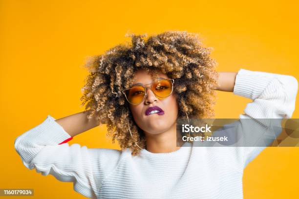 Flirty Young African American Woman Stock Photo - Download Image Now - 1960-1969, 1970-1979, Adult