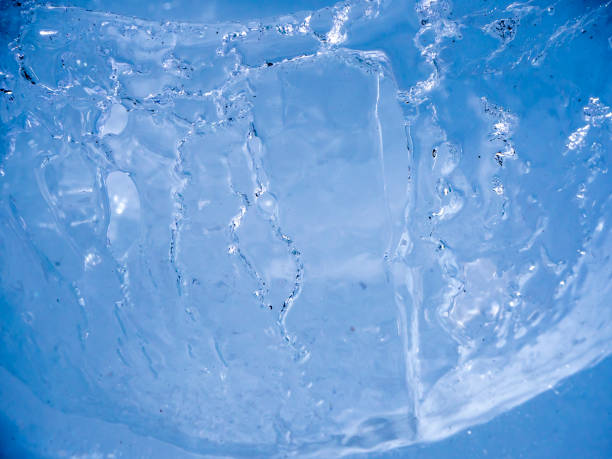 istock Ice surface shot up close with sun illuminating and melting the ice 1160179129