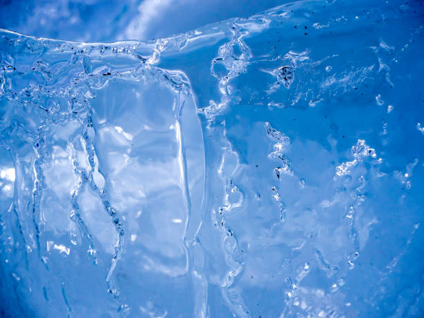 istock Ice surface shot up close with sun illuminating and melting the ice 1160179243