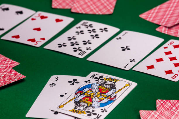 istock Playing cards on the green table 1160179361