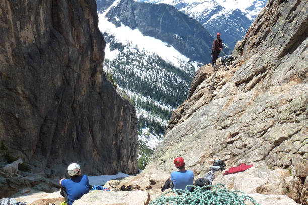 Liberty Bell, Washington - July 6th, 2012: Rock Climbers watching a climber belaying at the first pitch of Beckey Route on Liberty Bell in Washington USA.