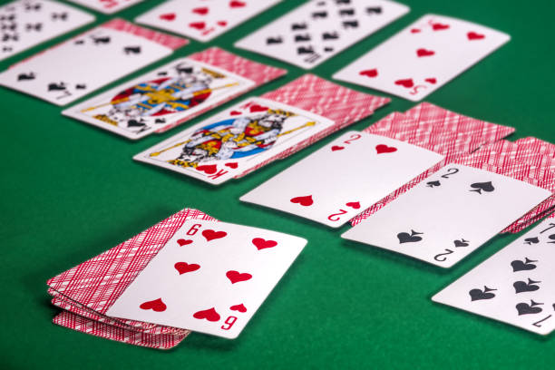 istock Playing cards on the green table 1160179460
