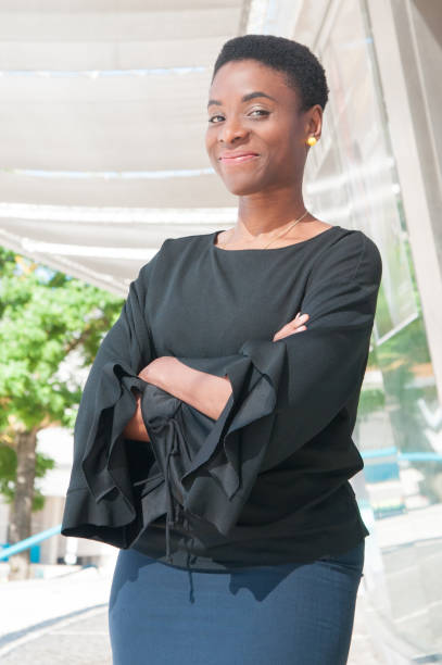 istock Cheerful confident black woman posing with arms folded 1160180716