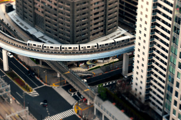 A diorama style photo of the "Yurikamome" train on the Tokyo Waterfront New Transit Rinkai Line, which runs through an apartment complex district in central Tokyo Scenery in Tokyo diorama photos stock pictures, royalty-free photos & images